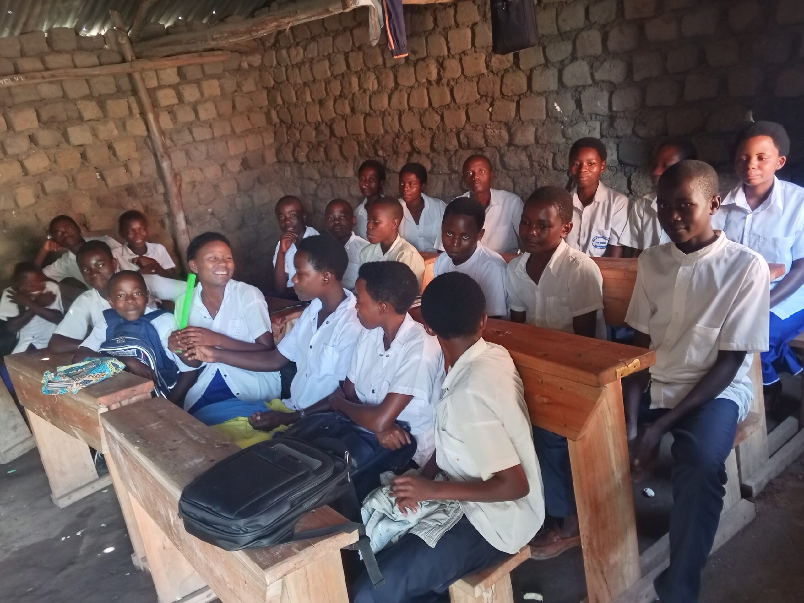 Help me set up a small public secretarial service and provide the children of Idjwi with access to hands-on computer training.
